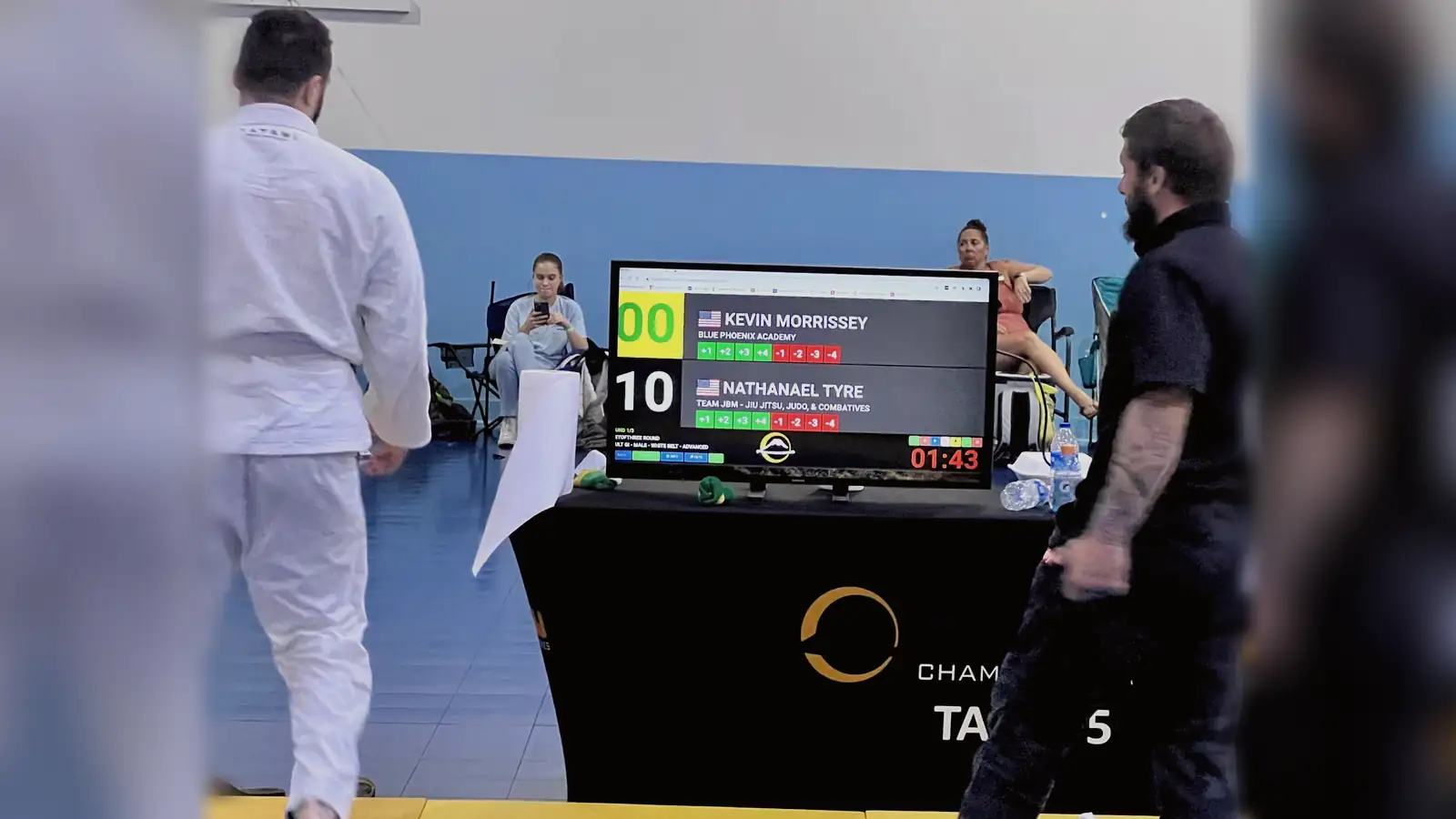 A competition scoreboard reading Nathanael Tyre 10 and Kevin Morrissey 0.