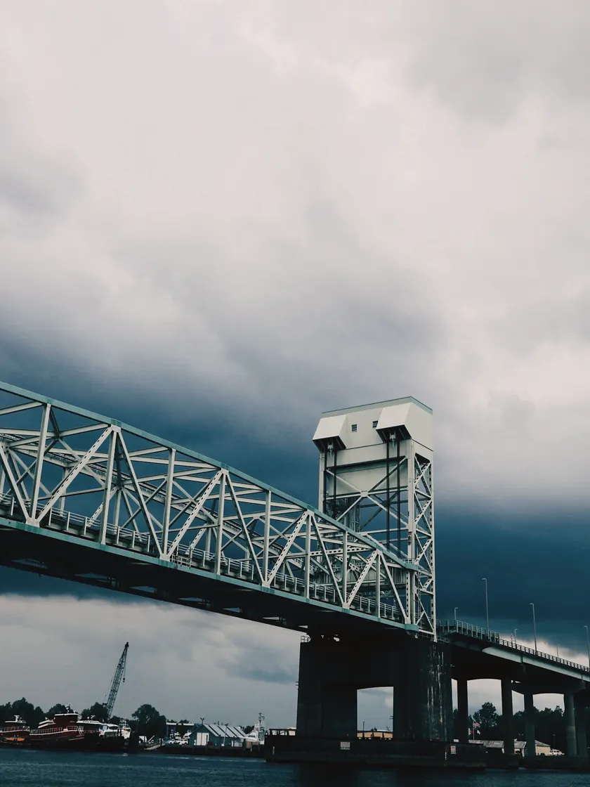 The lift bridge at Wilmington, steel truss under a low grey storm.