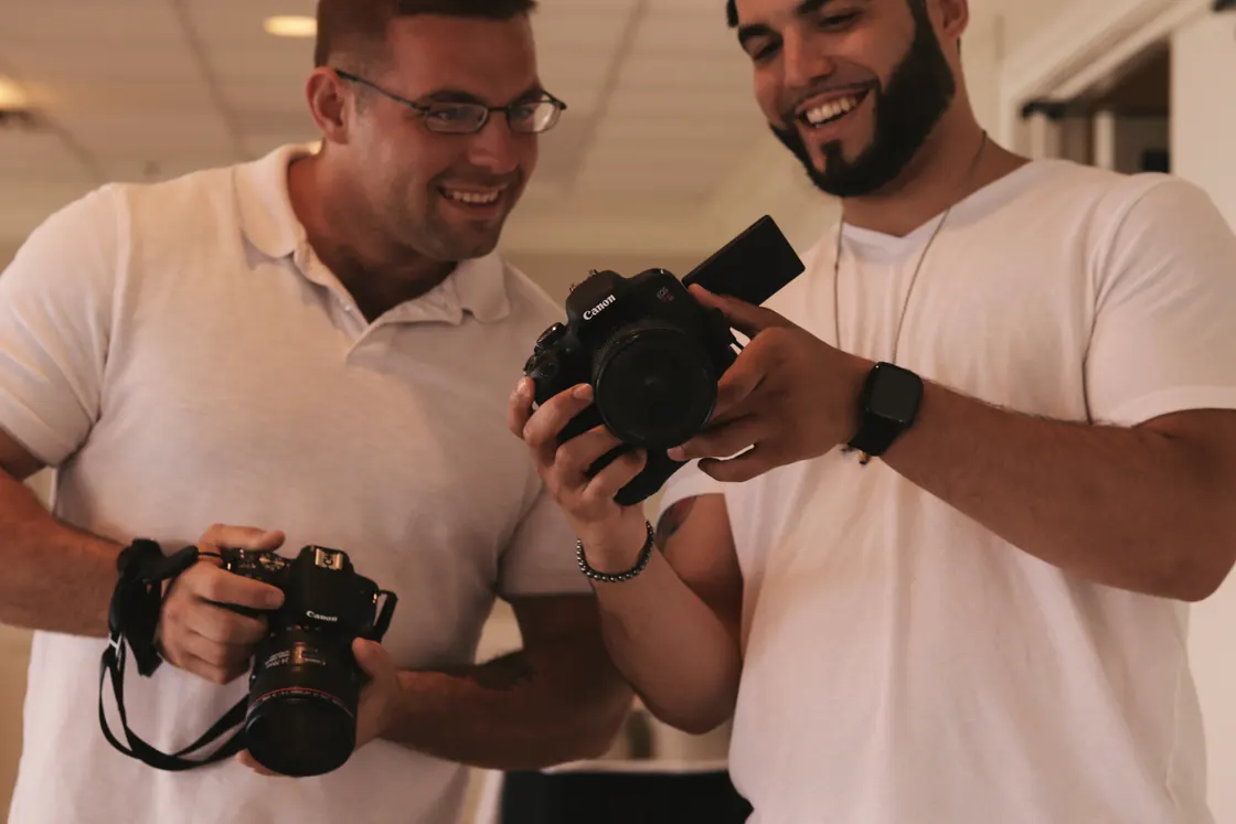 Austen and me with a camera each, grinning at the back of his.